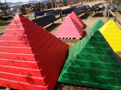 Fibreglass jungle gym caps in red, pink, green and yellow