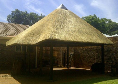 Thatched gazebo roof over a patio