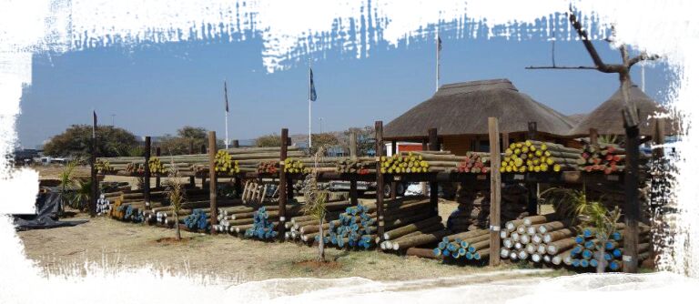 Pole yard with stacked CCA-treated poles